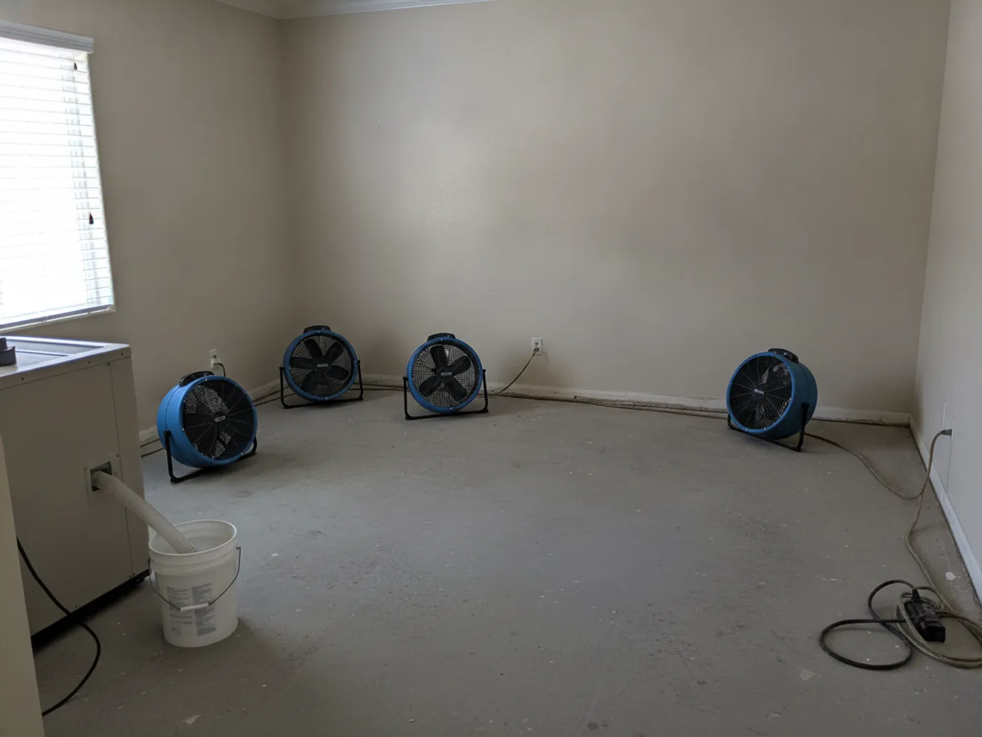 Commercial air movers and dehumidifiers drying a water-damaged Santa Clarita home